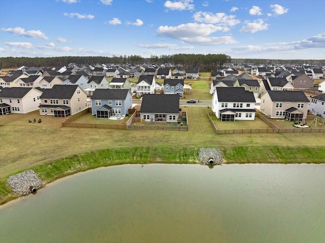 birds eye view of property with a residential view and a water view