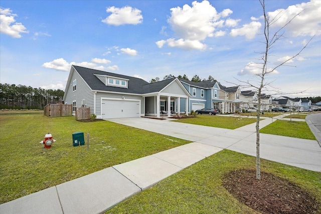 view of front facade featuring a garage, driveway, and a front lawn