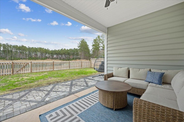 view of patio / terrace featuring a gate, a fenced backyard, and an outdoor living space