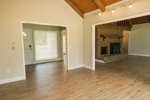 1044 Academy Rd, Walterboro, SC 29488 - unfurnished living room with wooden ceiling, wood finished floors, a brick fireplace, and baseboards