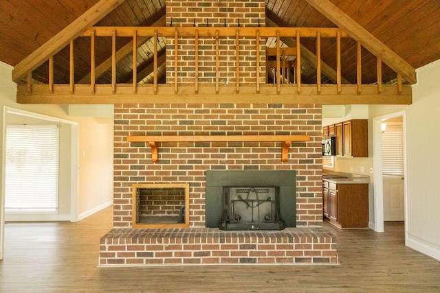 1044 Academy Rd, Walterboro, SC 29488 - unfurnished living room featuring a fireplace, wooden ceiling with exposed beams, baseboards, high vaulted ceiling, and wood finished floors