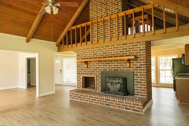 1044 Academy Rd, Walterboro, SC 29488 - unfurnished living room featuring high vaulted ceiling, a fireplace, wood finished floors, ceiling fan, and baseboards