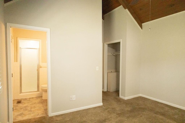 1044 Academy Rd, Walterboro, SC 29488 - unfurnished bedroom with carpet, lofted ceiling, a closet, ensuite bath, and baseboards