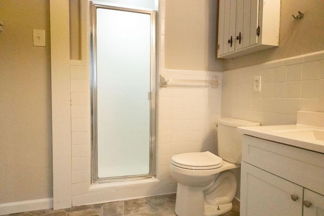 1044 Academy Rd, Walterboro, SC 29488 - full bath with vanity, tile walls, toilet, a shower stall, and wainscoting