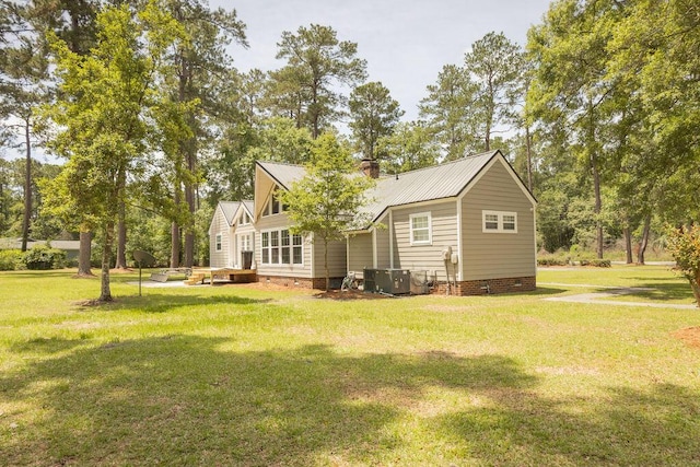 1044 Academy Rd, Walterboro, SC 29488 - back of house with a yard, crawl space, central AC, and metal roof