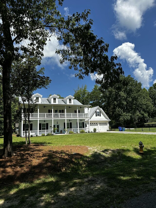 5681 Captain Kidd Rd, Hollywood, SC 29449 - back of house featuring a porch, a lawn, and a garage