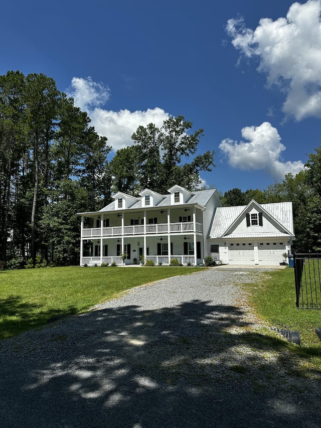 5681 Captain Kidd Rd, Hollywood, SC 29449 - view of front of home with covered porch, driveway, a front lawn, and an attached garage
