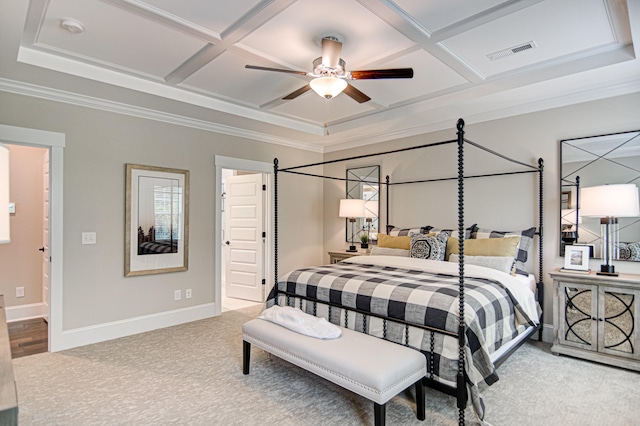 carpeted bedroom featuring ceiling fan, coffered ceiling, and ornamental molding