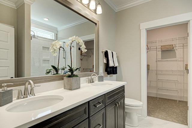 bathroom with vanity, toilet, and ornamental molding