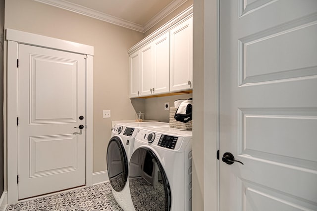 laundry area featuring cabinets, washer and dryer, and ornamental molding