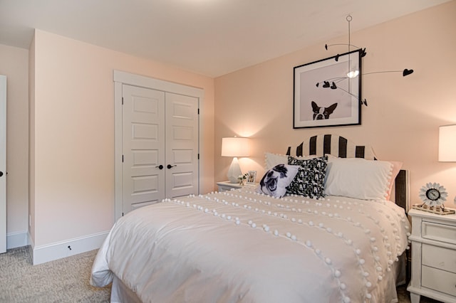 carpeted bedroom featuring a closet