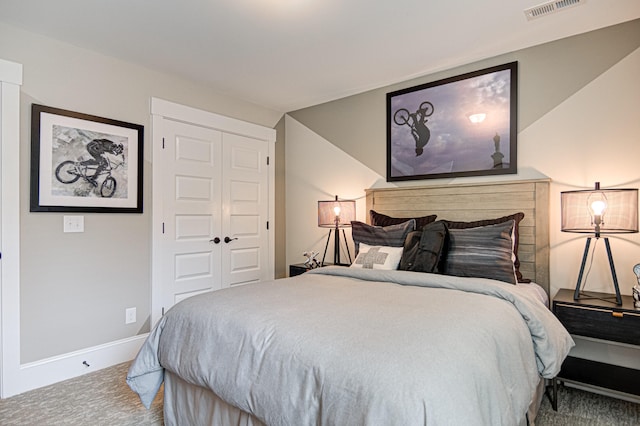 carpeted bedroom featuring a closet