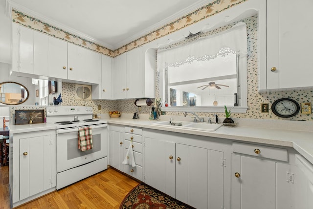 kitchen with electric stove, sink, crown molding, white cabinets, and light wood-type flooring