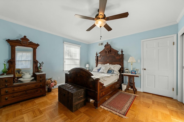 bedroom with ceiling fan, ornamental molding, and light parquet floors