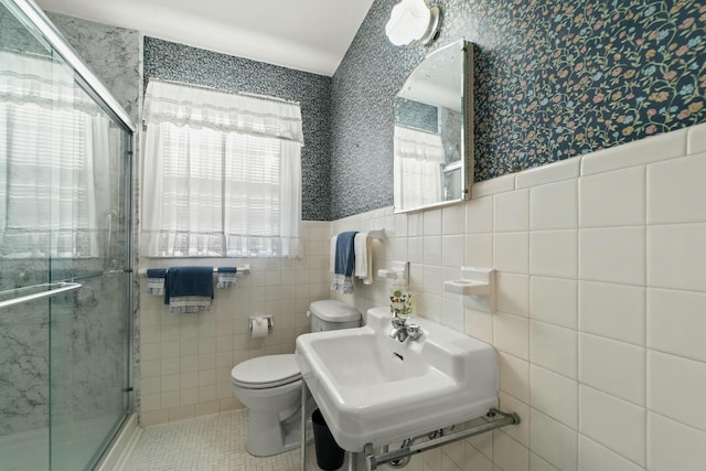 bathroom featuring walk in shower, toilet, tile patterned flooring, and sink