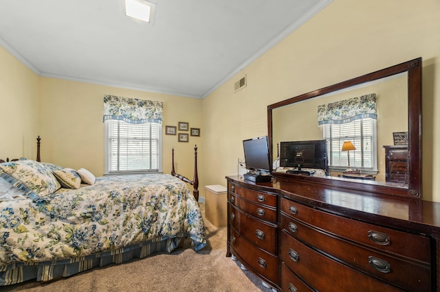 bedroom with crown molding and carpet flooring