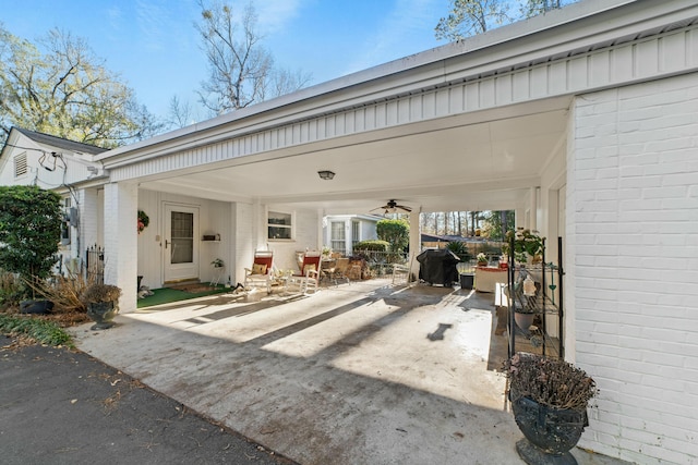 view of patio featuring area for grilling and ceiling fan