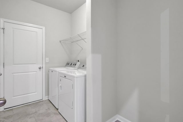 laundry room featuring washing machine and dryer