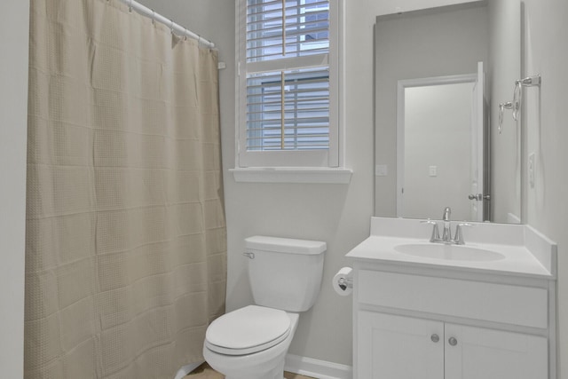 bathroom with vanity, toilet, and a shower with shower curtain