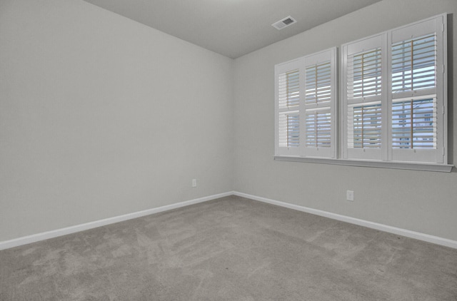 empty room with light colored carpet