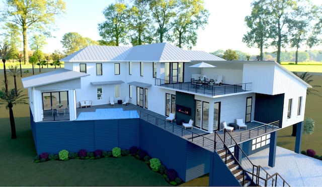 view of front of property featuring an outdoor living space, a patio area, and a balcony