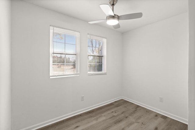 spare room featuring ceiling fan and wood-type flooring