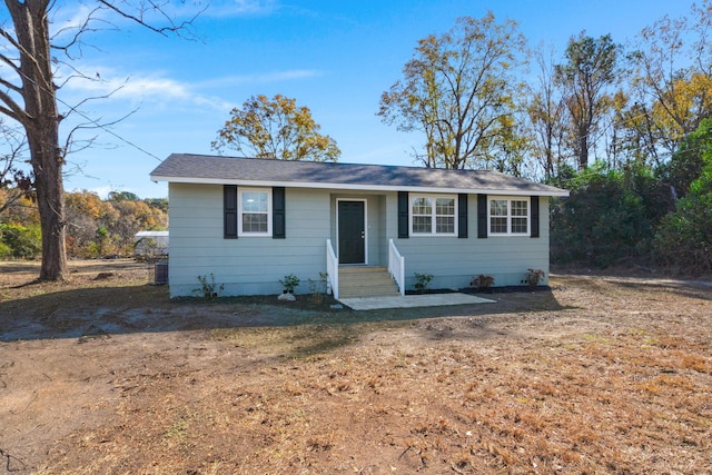 single story home featuring a front yard