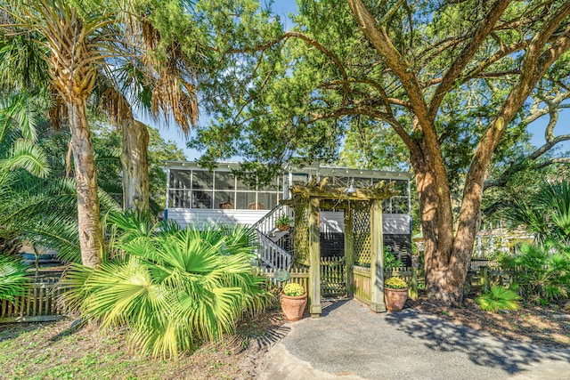 view of front of house with a sunroom