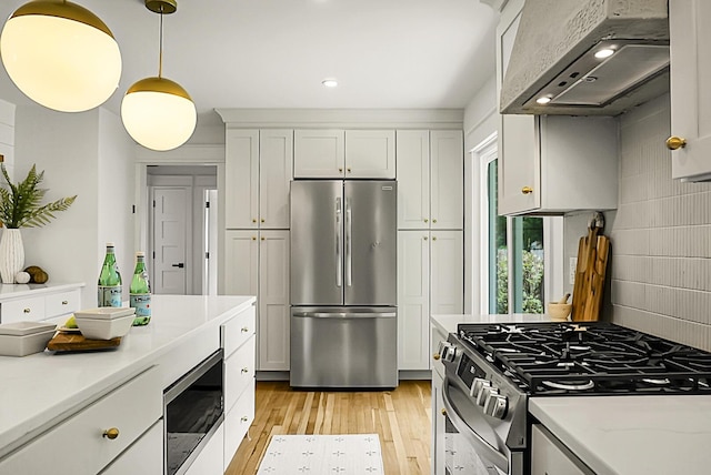 2456 Lantern St, Charleston, SC 29414 - kitchen with stainless steel appliances, range hood, light wood-type flooring, recessed lighting, and decorative light fixtures