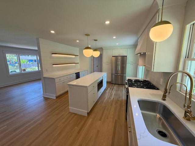 2456 Lantern St, Charleston, SC 29414 - kitchen featuring stainless steel appliances, light wood-type flooring, decorative backsplash, a kitchen island, and recessed lighting