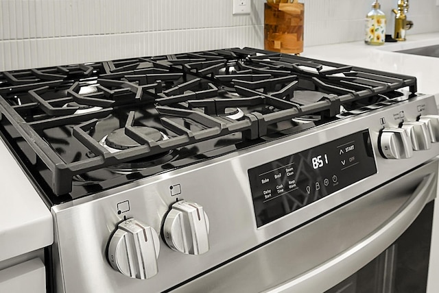 2456 Lantern St, Charleston, SC 29414 - detailed view of stainless steel range with gas stovetop and tasteful backsplash