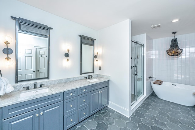 full bath with a stall shower, visible vents, a sink, and tile patterned floors