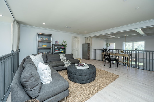 living area with light wood-style floors, visible vents, ornamental molding, and recessed lighting