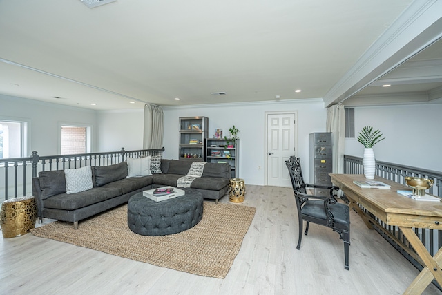 living area featuring light wood-style flooring, visible vents, crown molding, and recessed lighting