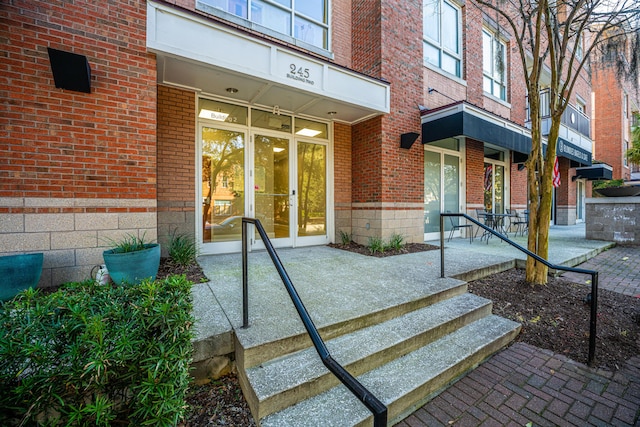 property entrance with brick siding