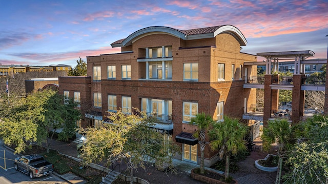 back of house featuring brick siding