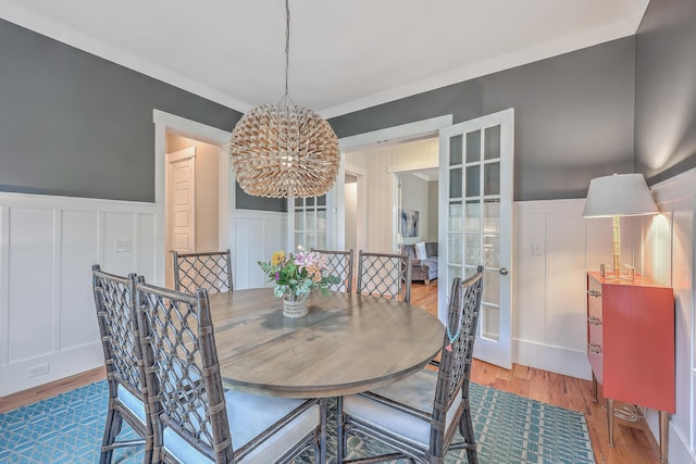 dining room featuring an inviting chandelier and hardwood / wood-style floors