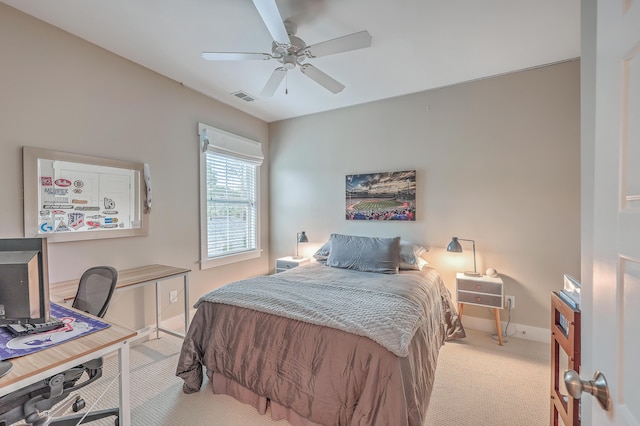 bedroom featuring light carpet and ceiling fan