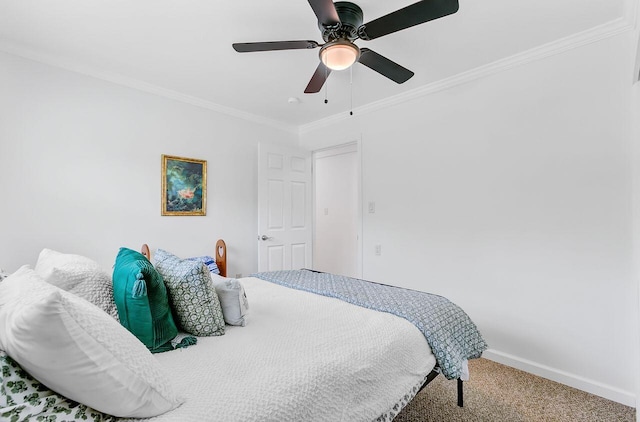 bedroom featuring ceiling fan, baseboards, carpet, and ornamental molding