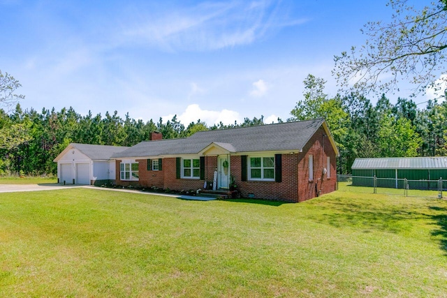 ranch-style home featuring fence, a front lawn, concrete driveway, an attached garage, and brick siding