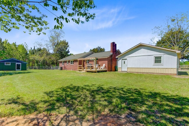 exterior space with a wooden deck and fence