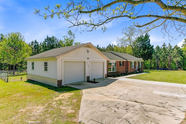 single story home featuring fence, brick siding, a front yard, and concrete driveway