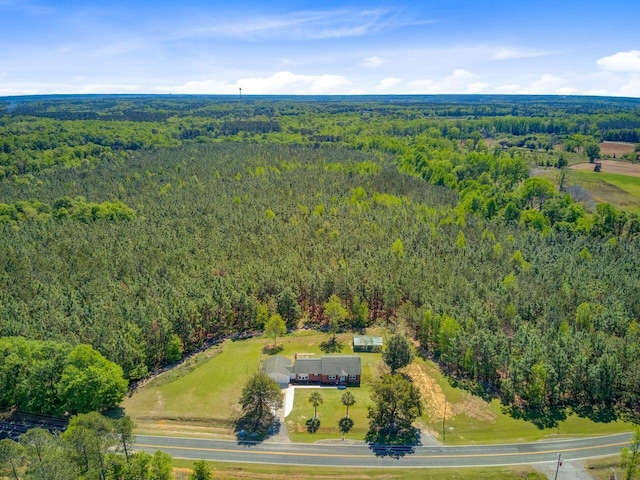 aerial view with a wooded view