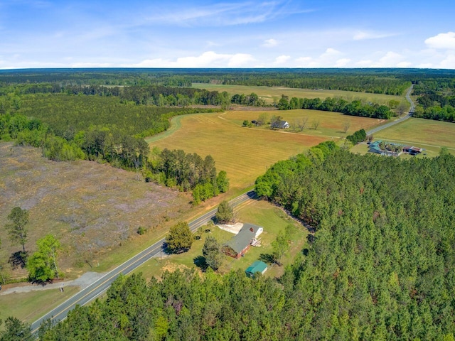 bird's eye view with a rural view and a view of trees