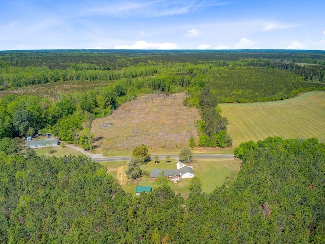 drone / aerial view with a view of trees