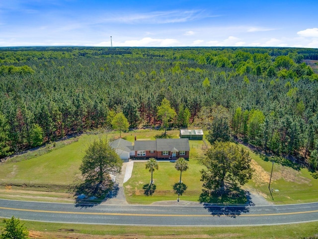 drone / aerial view with a view of trees