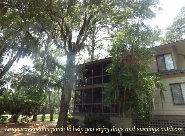 back of property with a sunroom