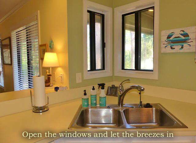 interior space with light countertops and a sink