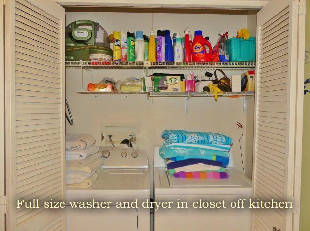 clothes washing area featuring laundry area and washer and clothes dryer