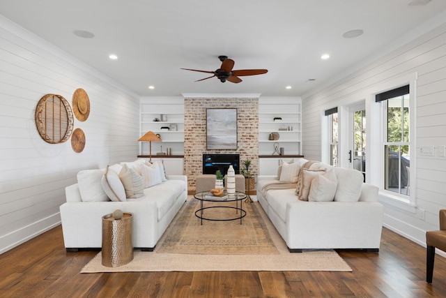 living room featuring wood walls, dark hardwood / wood-style floors, and ceiling fan